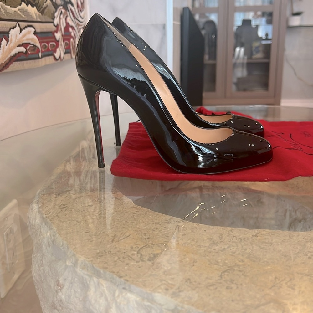 Christian Louboutin Dolly patent leather pumps.